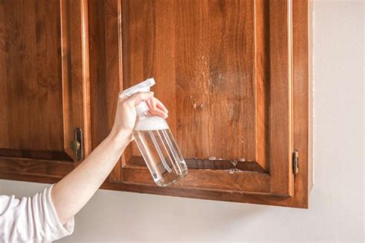 How do you clean dark kitchen cabinets