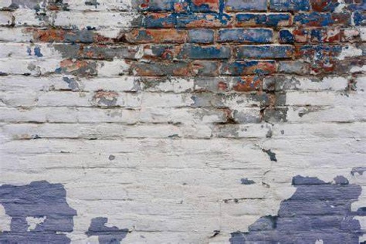 How do you get old paint off red brick