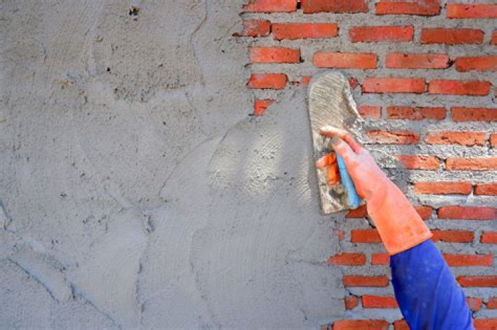 How do you plaster over brick