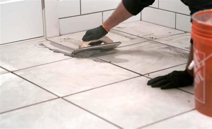 Should porcelain tiles be sealed before grouting