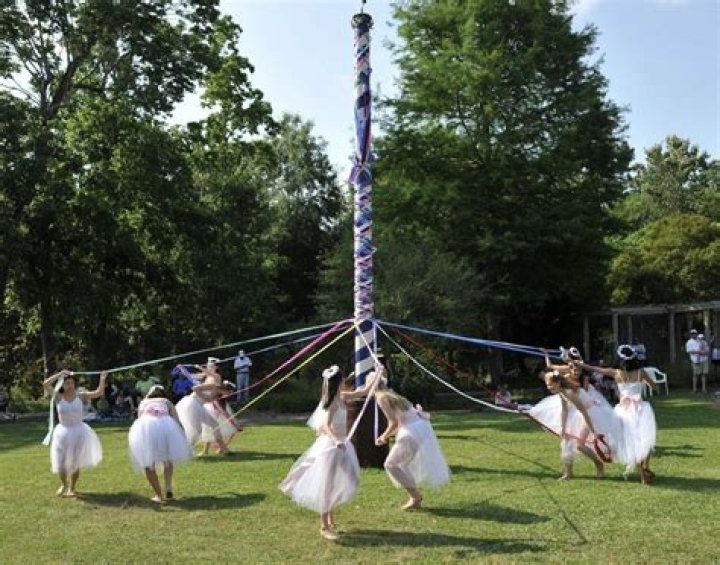 Why do people dance around the Maypole